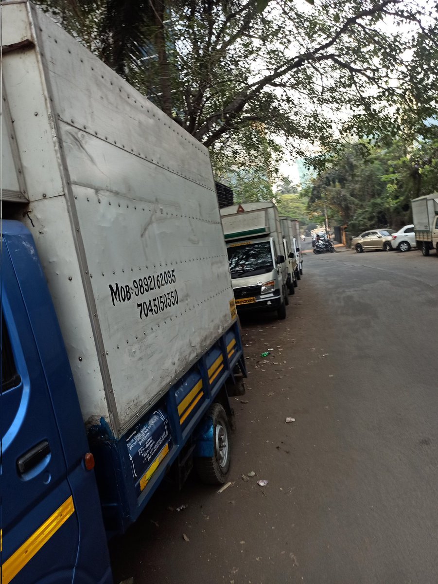 abneesh's tweet photo. Footpath in Windsor lane in Kalina, Santa Cruz east. Vada pav stall has taken up full footpath, uses gas cylinder (banned on street). an old sofa put by truck drivers. Both sides of street have 10 trucks parked at night till 11 am. No space to walk on footpath Or road. Pl help https://t.co/gxDtEB6Vrl
