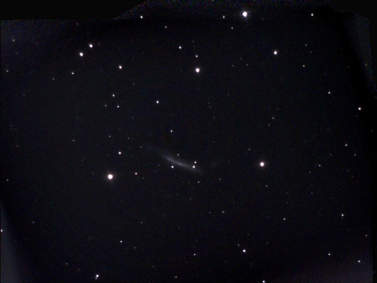 AstroMikeMerri's tweet photo. A partly clear night for some non-#LockDownAstronomy with the #eVscope last night, so a look at the edge-on spiral galaxy NGC 3432. Its slightly distorted shape seems to be driven by its gravitational interactions with the faint companion just to the right in this image. https://t.co/gtiFWkg7qf