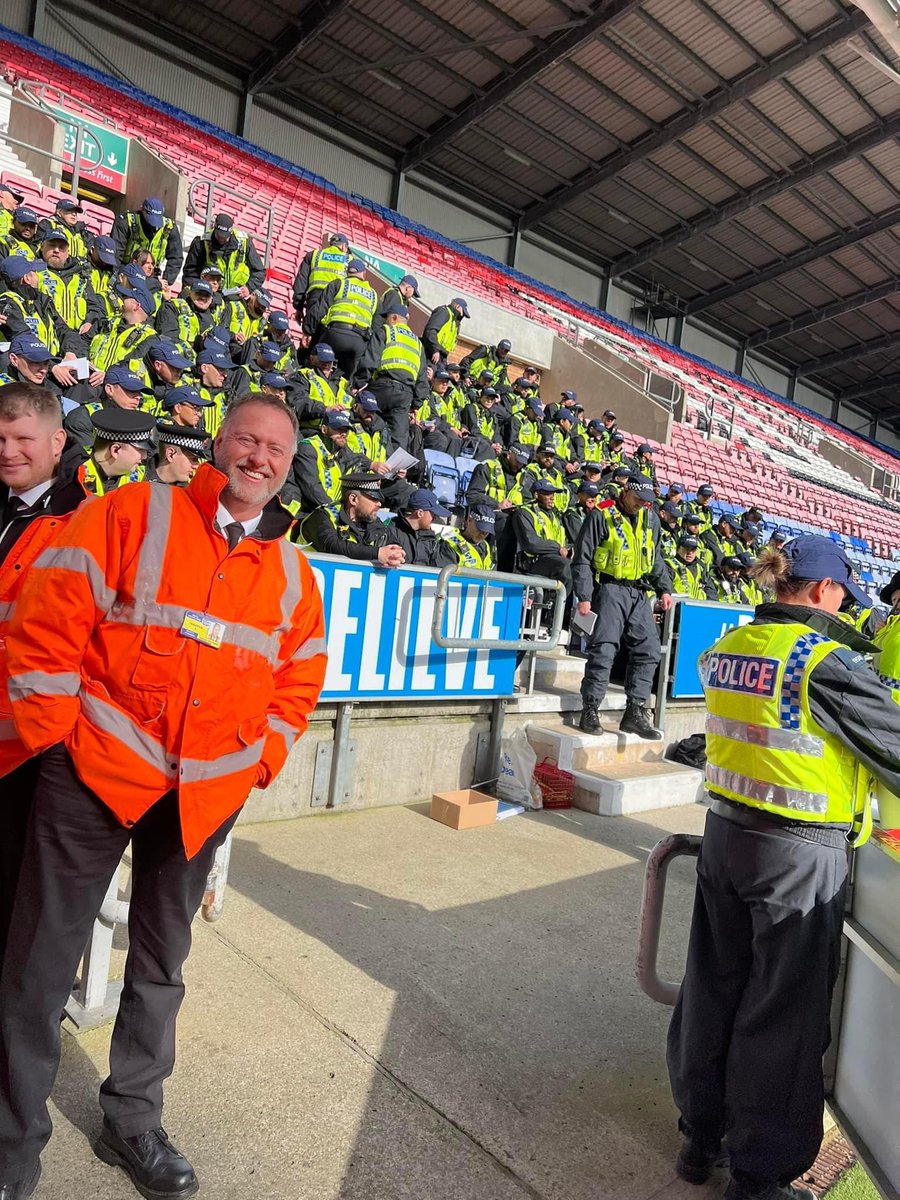 FBAwayDays's tweet photo. The police at Wigan’s DW stadium ahead of their local derby with Bolton today. #WAFC #BWFC https://t.co/2DxRWU2vdF