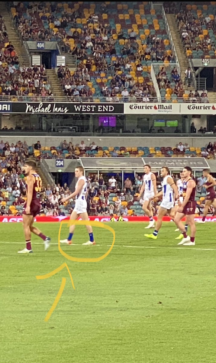 BrennanMonique's tweet photo. Oops! Who forgot to pack Tom Powell’s socks? Or is it a sign of what happens when you know you have to play against Mitch Robbo? @brisbanelions @thefrontbar7 @TitusOReily #afllionsnorth https://t.co/qCCNg9jx6b