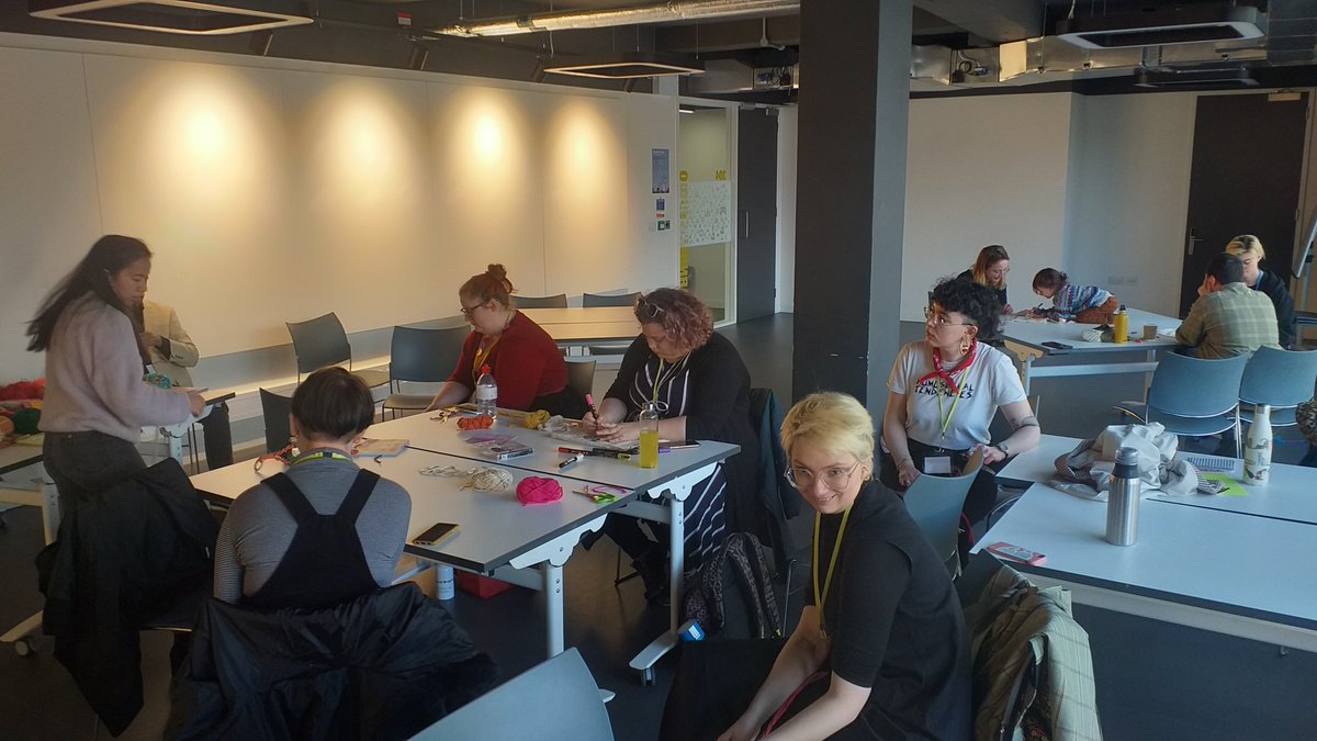 Outsiders2023's tweet photo. The third floor is now a peaceful creative space. @itszoesmith from Queer Crafts Brighton is leading our delegates in a quiet workshop themed around 'Queerness through Crafting'.

Radical tote bags, rainbow bracelets and a collection of macrame hangers are in construction 🧶🧵✒ https://t.co/rbGfhlTT5v