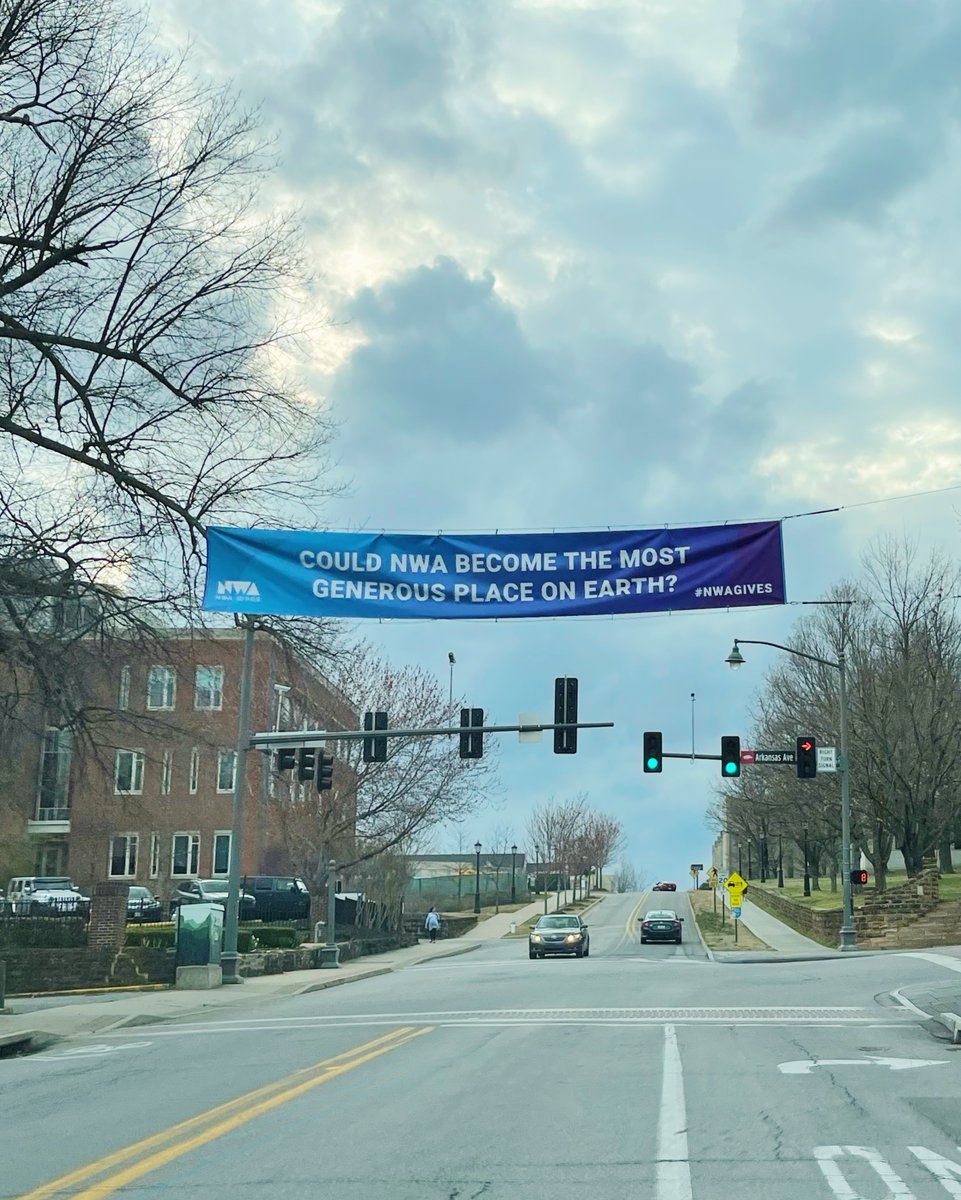 The sign says it all!  🧡 💙 💜 Give now at NWAGives.org!