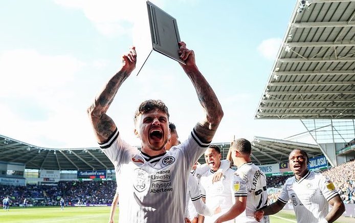 Best picture of the day is Jamie Paterson celebrating with a laptop
