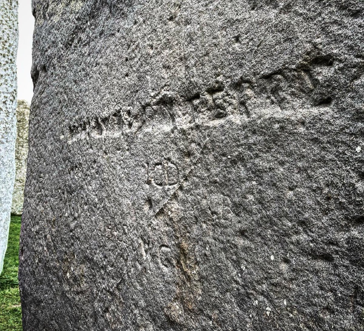 Feeling the weird energies of Stonehenge in sun + snow. Graffiti includes a dagger from the Bronze Age and the name of local architect Christopher Wren, who made the dome of St Paul’s Cathedral with the same geometries.