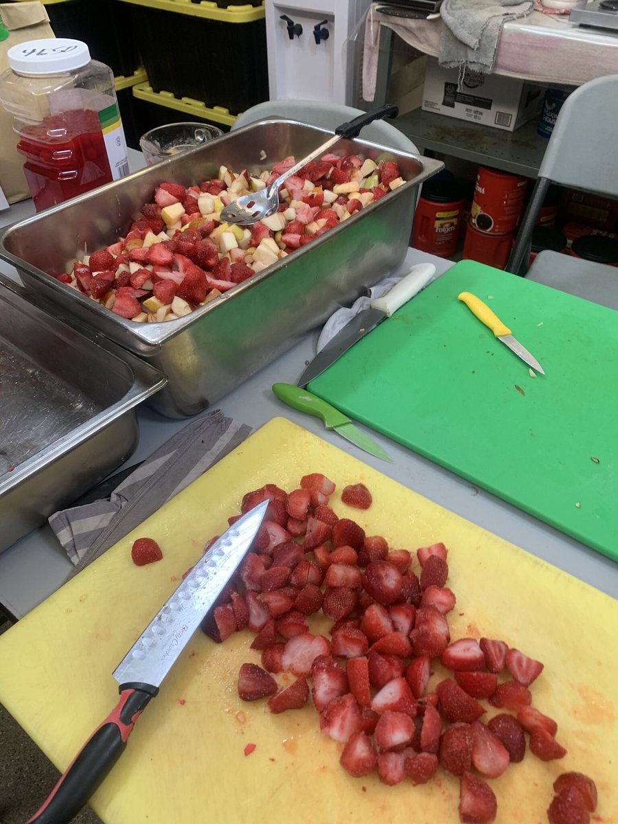 thomjeff's tweet photo. Some happy volunteers (yes, we grab a cup) and I’m sure a few guests with some quality @WhitneyCoffeeCo coffee. A bit of spring/summer with a fruit salad for dinner and giant potatoes cut for mash and hash browns.

Thanks Ron &amp; Whitney! #Fredericton https://t.co/7XS7yF9IKj