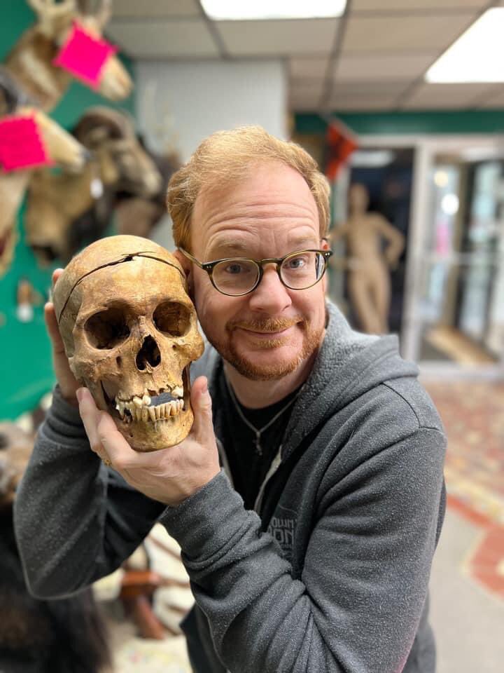 ApothicDen's tweet photo. Yesterday, we visited the Odditorium in Lapeer, MI. Yes, our Founder and Lead designer is holding a real human skull. 
#Justanormalsaturday #Bones #odditorum #weloveweirdthings @chrisnierhaus https://t.co/Hj6EvhglXw
