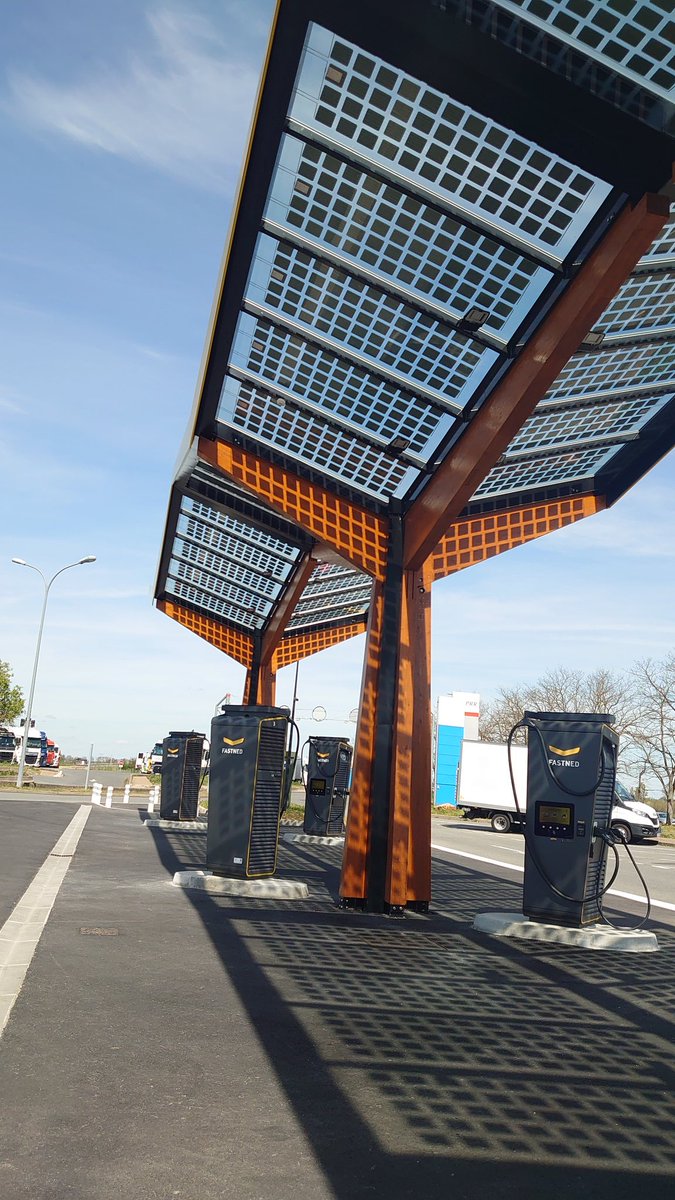 Lots of lovely solar for our next charge - super-easy charge with Fastned, quick and (relatively) cheap too. And all their electric comes from wind or solar☀️ #EVroadtrip #ipace #chargingstories