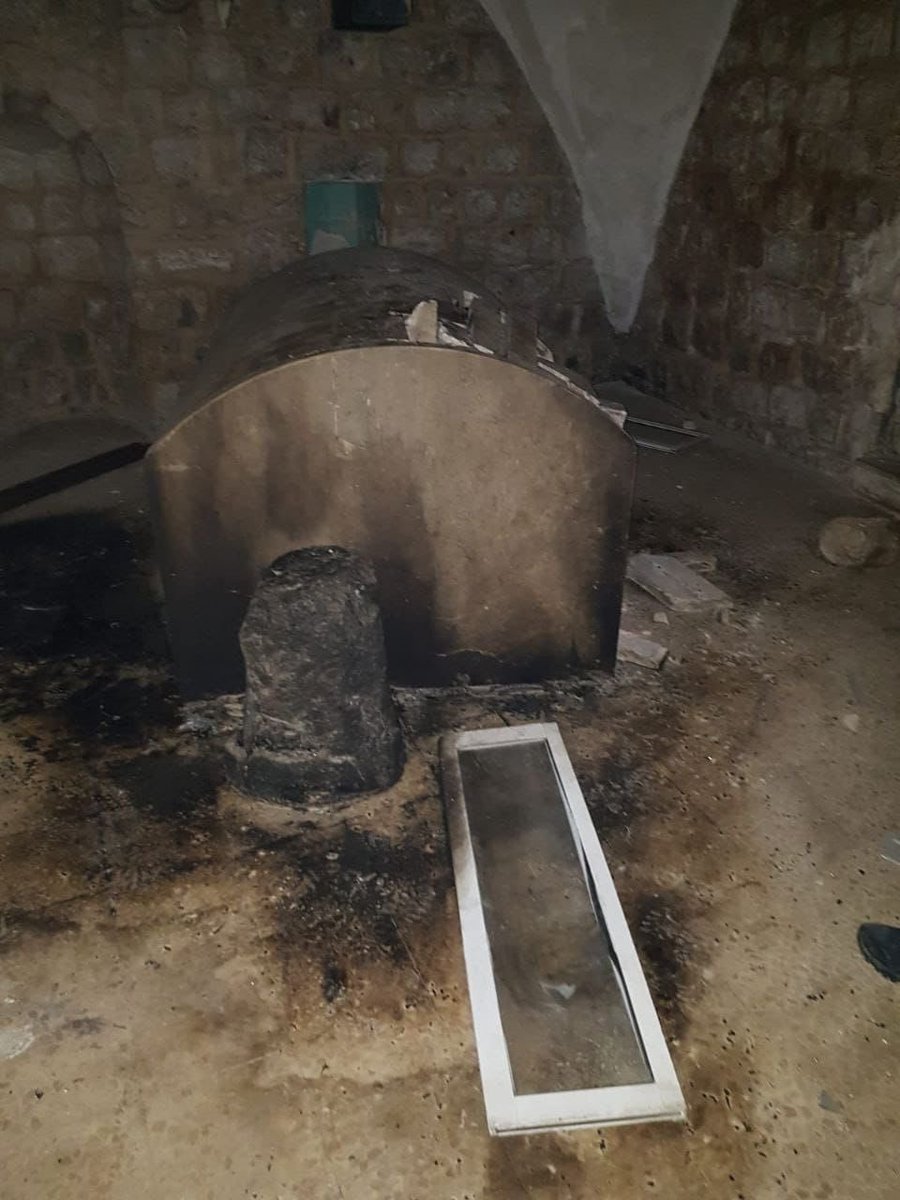 AviMayer's tweet photo. Scores of Palestinians attacked Joseph's Tomb in Nablus overnight.

After throwing hundreds of rocks at the Jewish holy site, they burst in and ransacked the place, smashing the grave marker and setting fire to the tomb.

The images are simply shocking, as is the world's silence. https://t.co/3yFXJjZx6Z