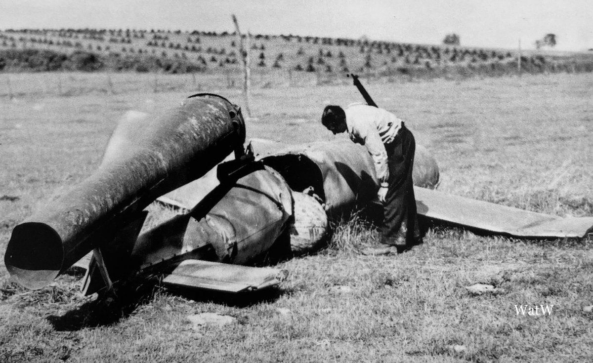 TheWorldatWar2's tweet photo. A British civilian examines the wreckage of a V1 Flying bomb that ran out of fuel before hitting its target - Southern England 1944 #ww2 #worldwar2 #v1 #v1rocket #doodlebug #england https://t.co/4ddf3f33l5