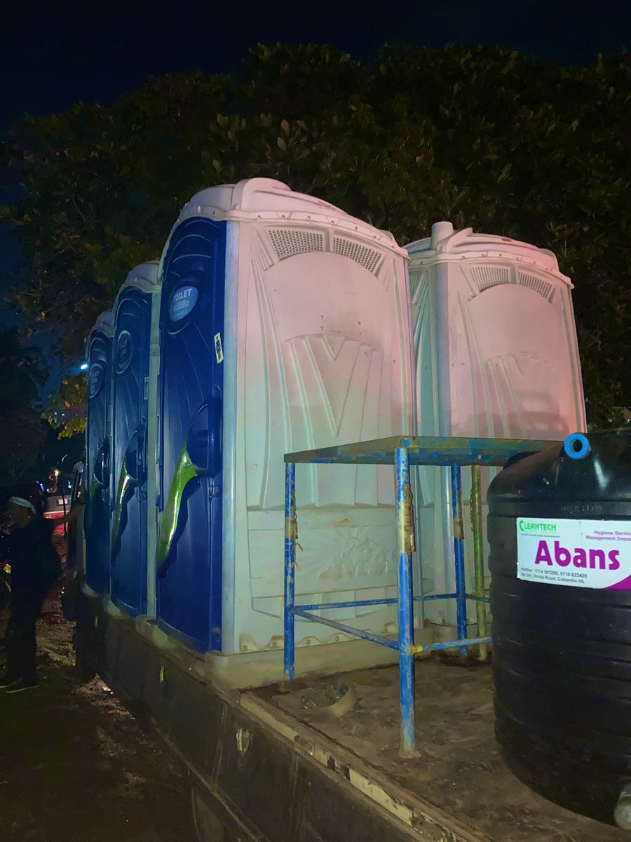 VikumRaj's tweet photo. The mobile toilets are here!!! Thank you so much to the two gentlemen who organised this &amp; have paid for the first 24-hrs. These units can be kept for longer but we'll need to fund it. Will share details soon. #GotaGoHome #GoHomeGota #GoHomeRajapaksas https://t.co/RDlVOLE81Q