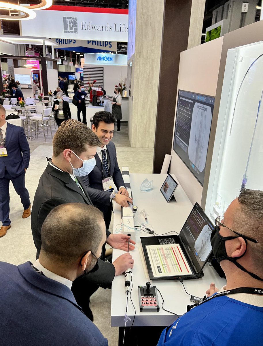 Dr. Khan, first year fellow, and Dr. Syed, <a href="/FAUmedIM/">FAUmedIM</a> rising fellow, deploying a TAVR valve at <a href="/ACCinTouch/">American College of Cardiology</a> #ACC22 🫀#FAU