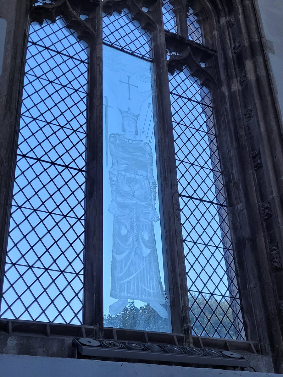 AlabasterMiss's tweet photo. The extremely effective etched image of King Edmund in the chancel by John Hutton, 1971. The original glass was punched out by Dowsing, then a German bomb narrowly missed it but any Victorian glass was shattered. I like the spare use of stained glass to be honest. https://t.co/DtbB1zZEv6