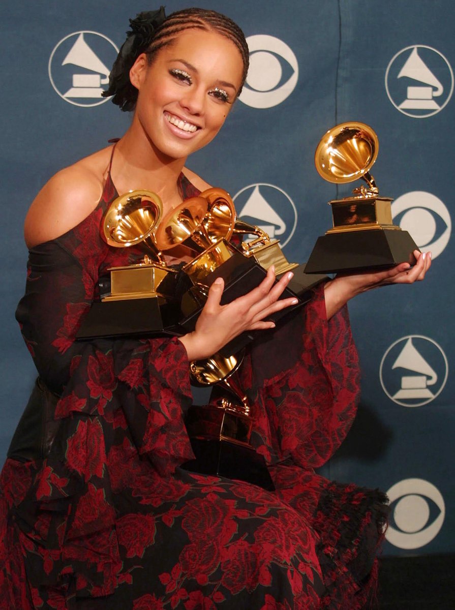 MattZeitlin's tweet photo. The only good thing about the grammys is when someone wins a bunch of awards and there’s a picture of them trying to hold all of them https://t.co/T9cypqQ9jS