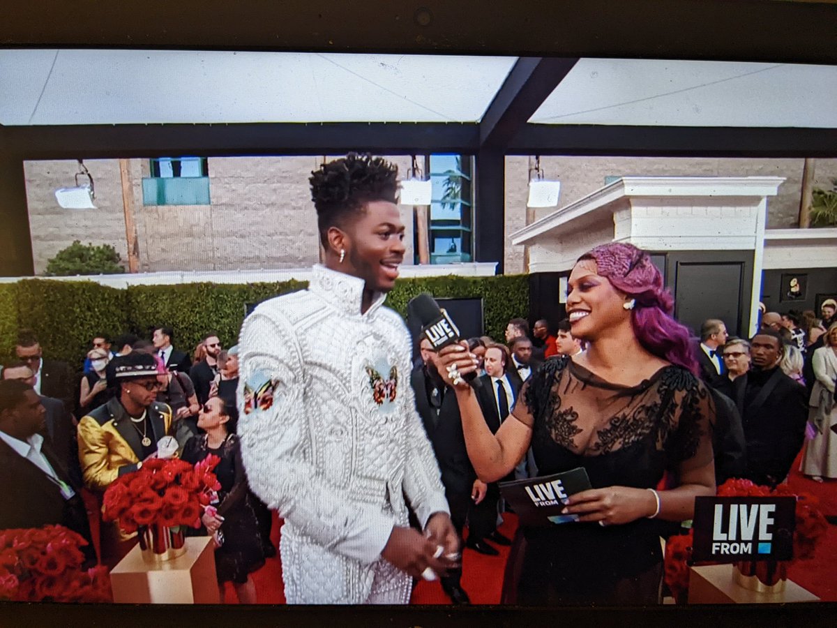 DeliaMary's tweet photo. Love seeing Lil Nas X and Laverne Cox together. She is truly such a good red carpet interviewer. He's thanking her for everything she's done for the community, she's telling him how proud of him she is and the whole thing has the vibe of an older sibling and a younger sibling. https://t.co/mvP8VSU7K0