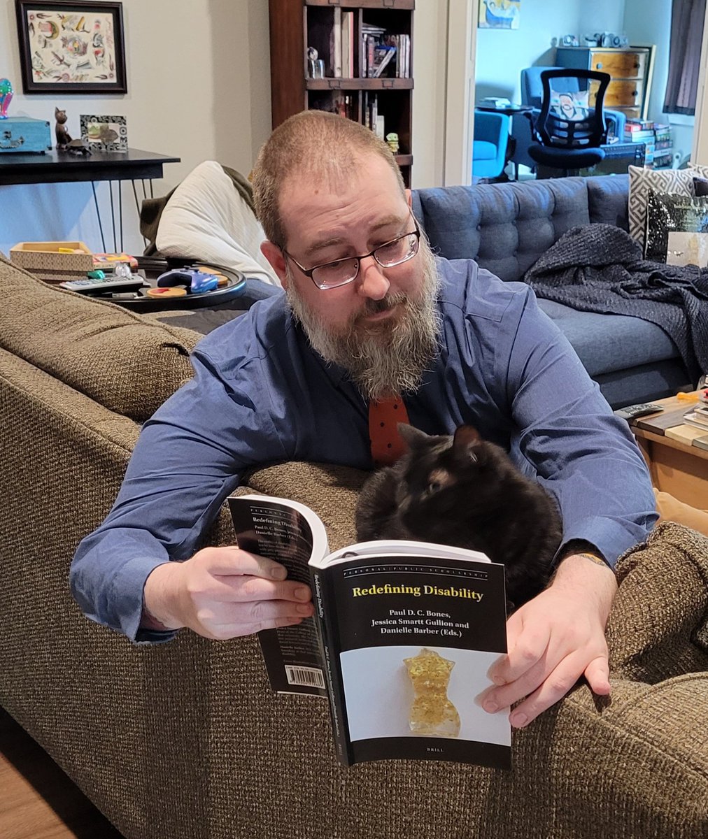 RoboticoEl's tweet photo. Inspired by @L_Historienne, I decided to do a photo shoot to celebrate the release of #RedefiningDisability. My shots aren't as good as hers, but it was kind of fun.
Millie seems interested in the book! Mostly. https://t.co/fHuScBIkFz