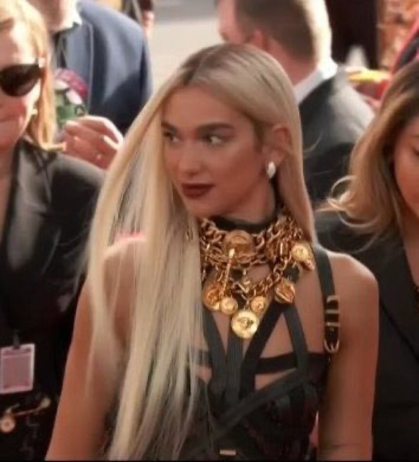 LipaToday's tweet photo. .@DuaLipa wears the iconic Versace FW92 Bondage Dress at the 2022 #GRAMMYs https://t.co/uF7QKKwXxz