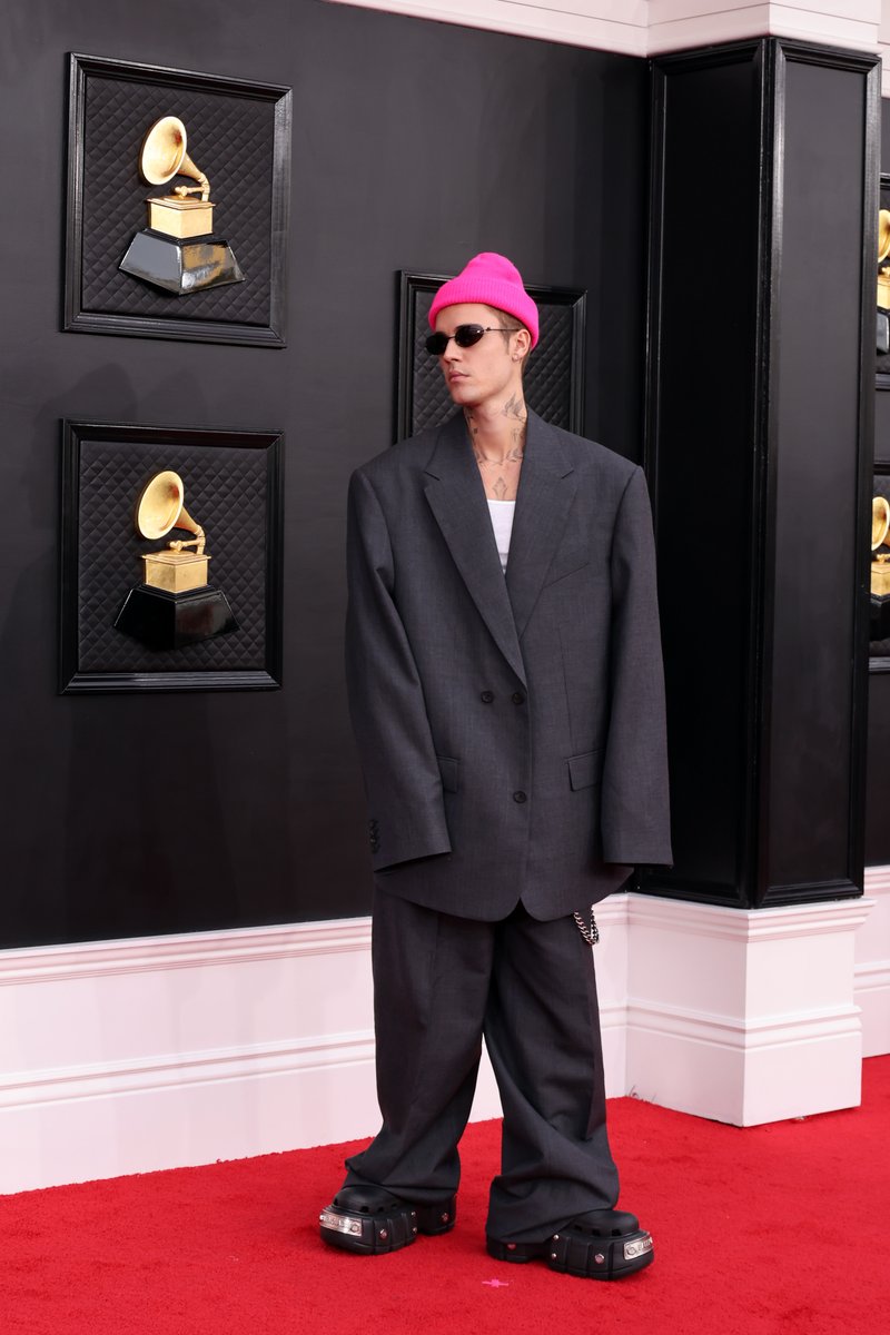 NYTStyles's tweet photo. Justin Bieber, nominated for eight awards, walked the red carpet in Balenciaga, complete with a pop of pink and platform crocs. 

Photo by Amy Sussman/Getty Images. https://t.co/7ryukwtFXP