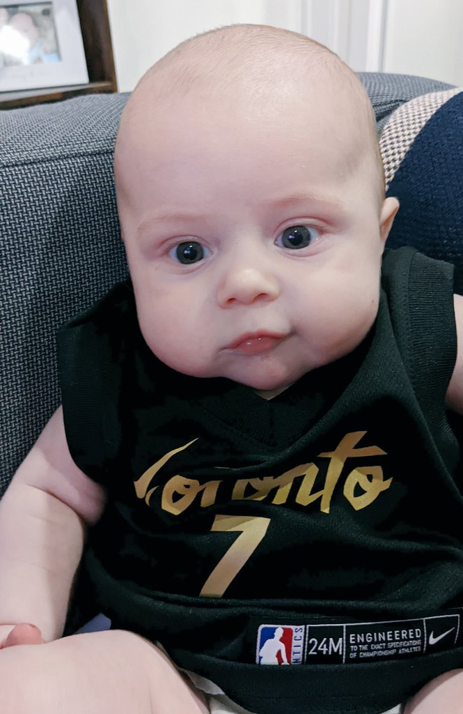 SonjaMissio's tweet photo. In his Sunday's best for @Klow7
#rtz
#tangerinefanangle
#WelcomeBackKyle
@Raptors
@TangerineHoops
(yes, our three-month-old baby is wearing a 24-month-old jersey) https://t.co/E1FS7kAETc