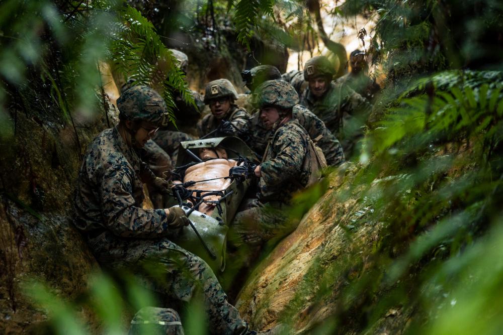 IIIMEF's tweet photo. #Marines with III MIG conducted casualty evacuation training at the Jungle Warfare Training Center.

@USMC photos by Cpl. Colton K. Garrett and Cpl. Lydia Gordon
#USMC #IIIMIG #Military https://t.co/aZVAI4j8Wl