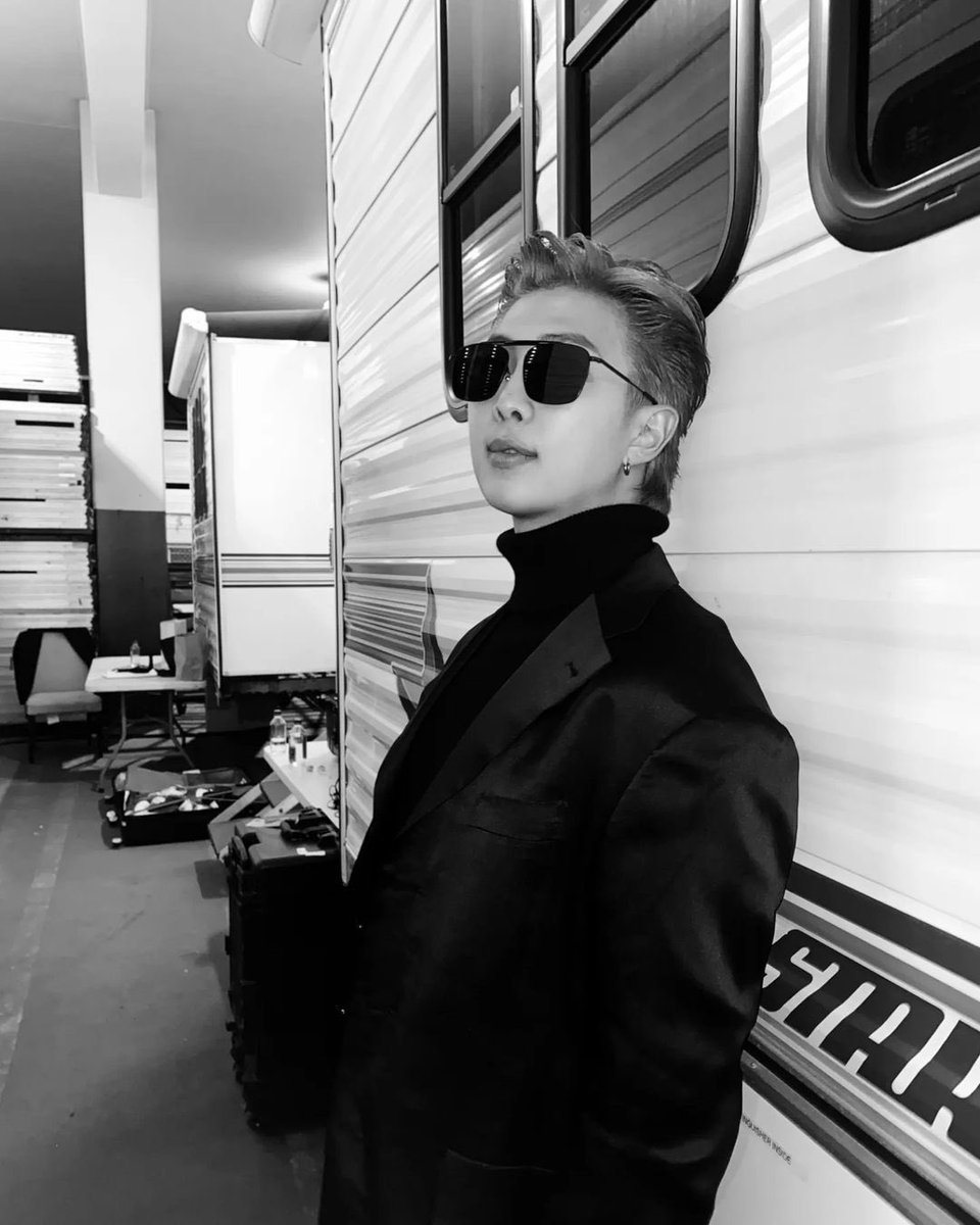 bts_we_are_7's tweet photo. Namjoon in black and white is

WE ARE SO PROUD OF BTS 
#OurProudBTS #GRAMMYs https://t.co/3NjVIUqnuB