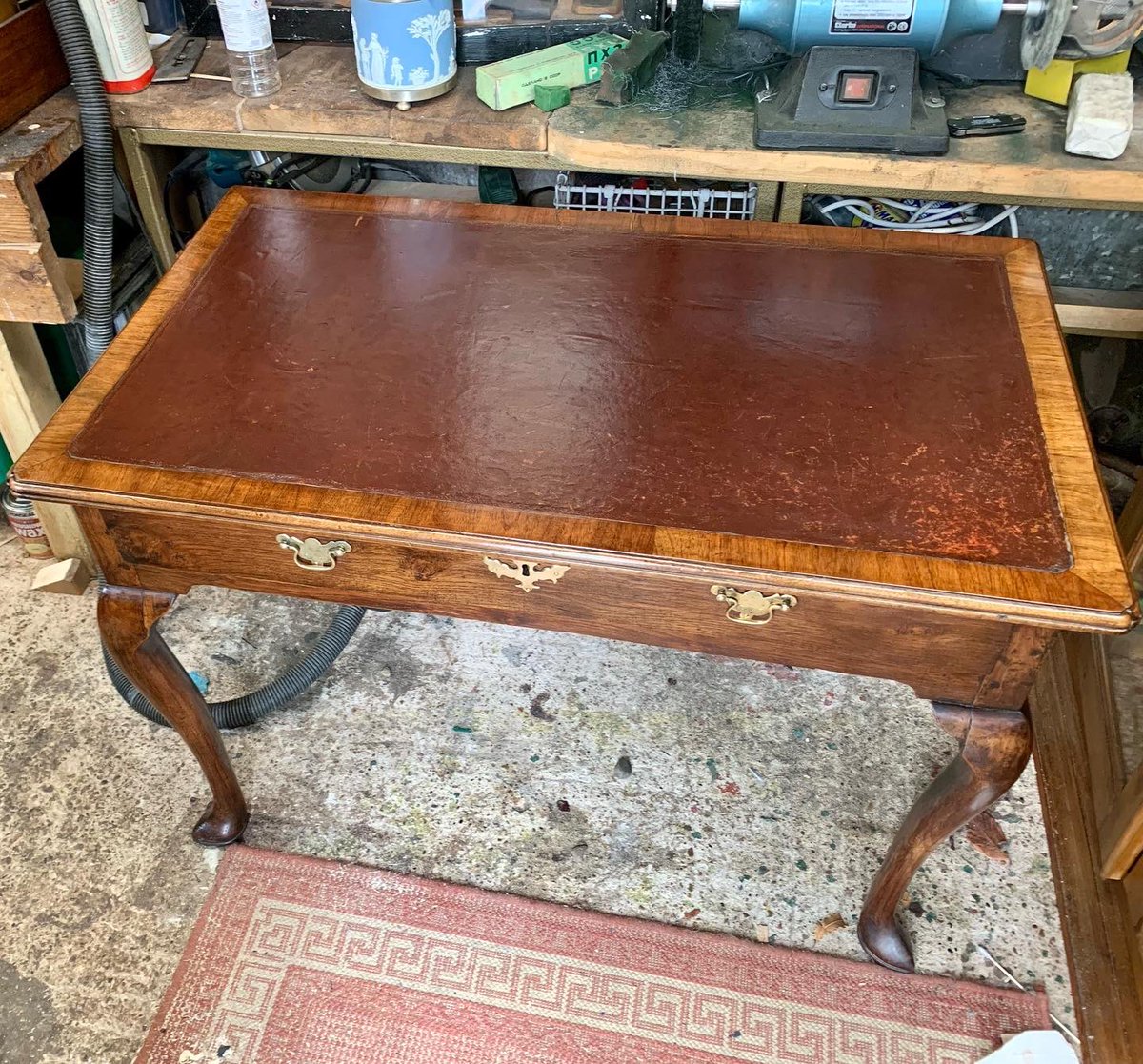 2016industrial's tweet photo. The Queen Anne writing table is finished. It looks amazing. 300+ years &amp; ready to go for another 300. I cleaned the brasswork &amp; then aged it back, so it wasn’t too shiny. Even Henry approves 😉 #restoration #workshop #queenanne #writingtable https://t.co/kF8dKnHaRA