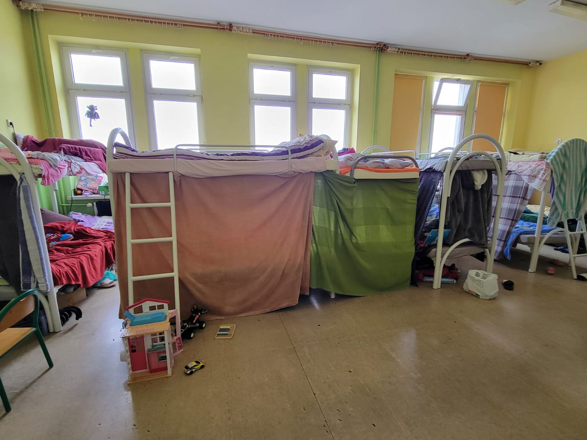 taagnew's tweet photo. 2/2 As you can see from the photo, the kids make dens using spare blankets which we were told makes them feel safer.

We plan to bring bed frames out from UK. Does anyone have any contacts in gov or military surplus supply in Poland where we might buy some more? https://t.co/fJIcy1ewMb