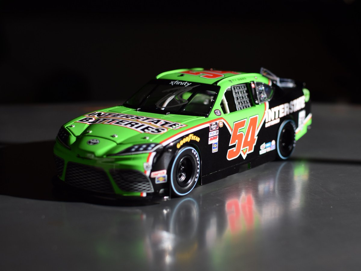 interstatebatts's tweet photo. Race fans, it’s giveaway time! 🎉

On May 7th at Darlington, @TyGibbs_ will be driving the No. 54 Interstate Batteries Toyota Supra with a throwback paint scheme 🏁 RT &amp; vote for your favorite paint scheme below and you could win a signed 2021 Darlington Throwback Diecast Car. https://t.co/Ych4cXSqtp