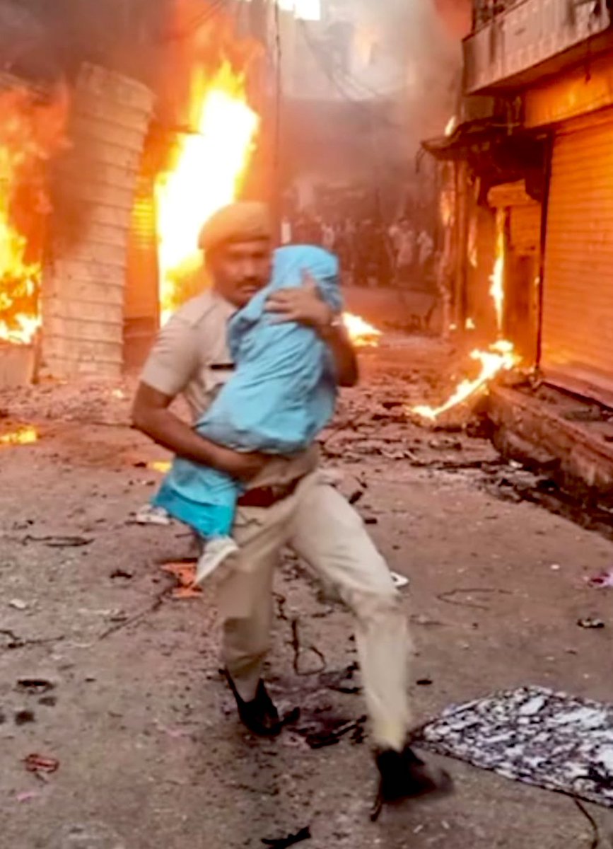 ARanganathan72's tweet photo. "I saw the flames closing in and rushed without thinking."

He braved stone-pelting &amp; arson to snatch the baby from its mother's lap and bring it to safety. Next time you are angry at the police, for whatever reason, even justifiably, remember his name. Constable Netresh Sharma. https://t.co/5RbiJTxqjR