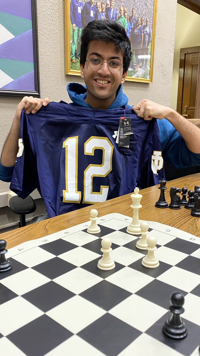 Pictured: Dave after destroying Arnel in a game of chess. Defeat Arnel for YOUR chance to get ND swag!