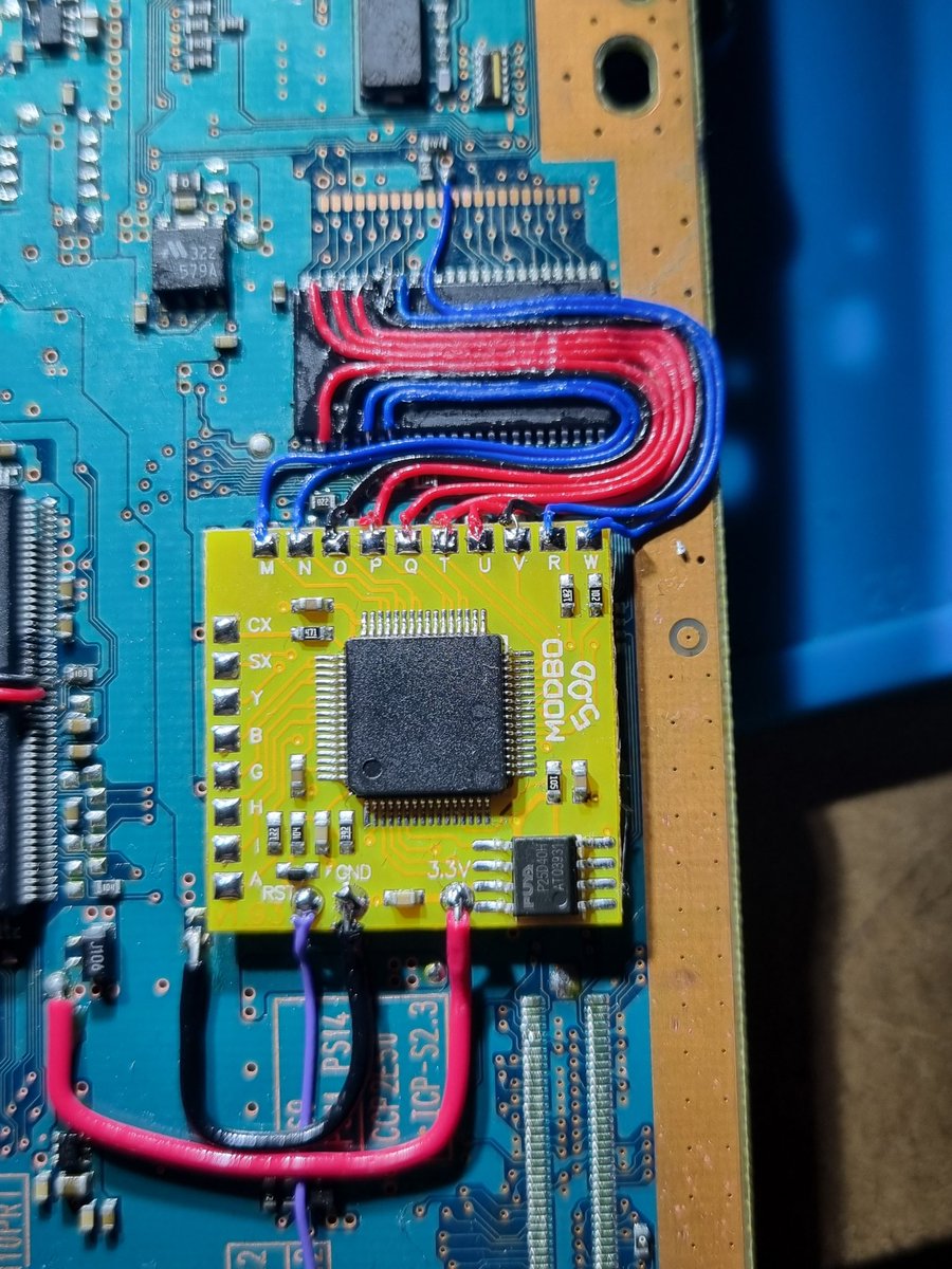 AcidzModShop's tweet photo. Started working on this #Modbo 5 install on this GH-23. These drive wires are kicking my arse. Such fine pitch soldering. #PS2 https://t.co/QoqkYKGLMu