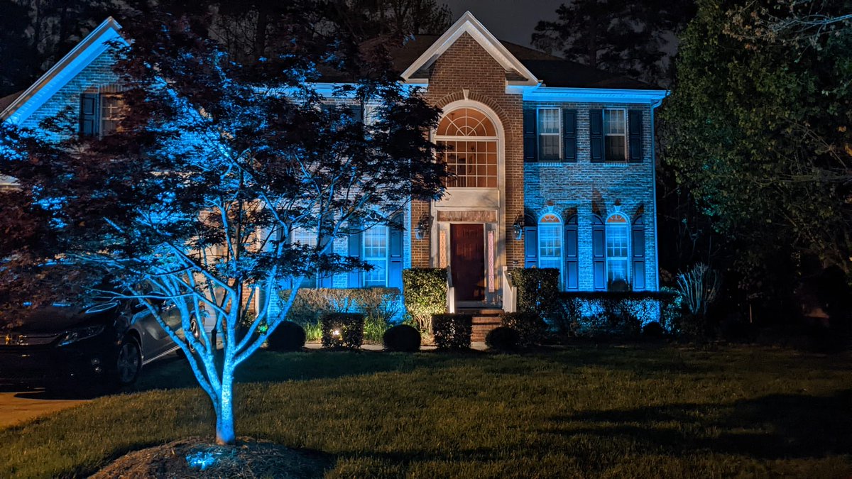 umeshpai's tweet photo. All shades are pointing to Carolina blue #GoHeels #MarchMadmess #UNC #WRALnews. House lit up to support our team https://t.co/oeNVjR042b