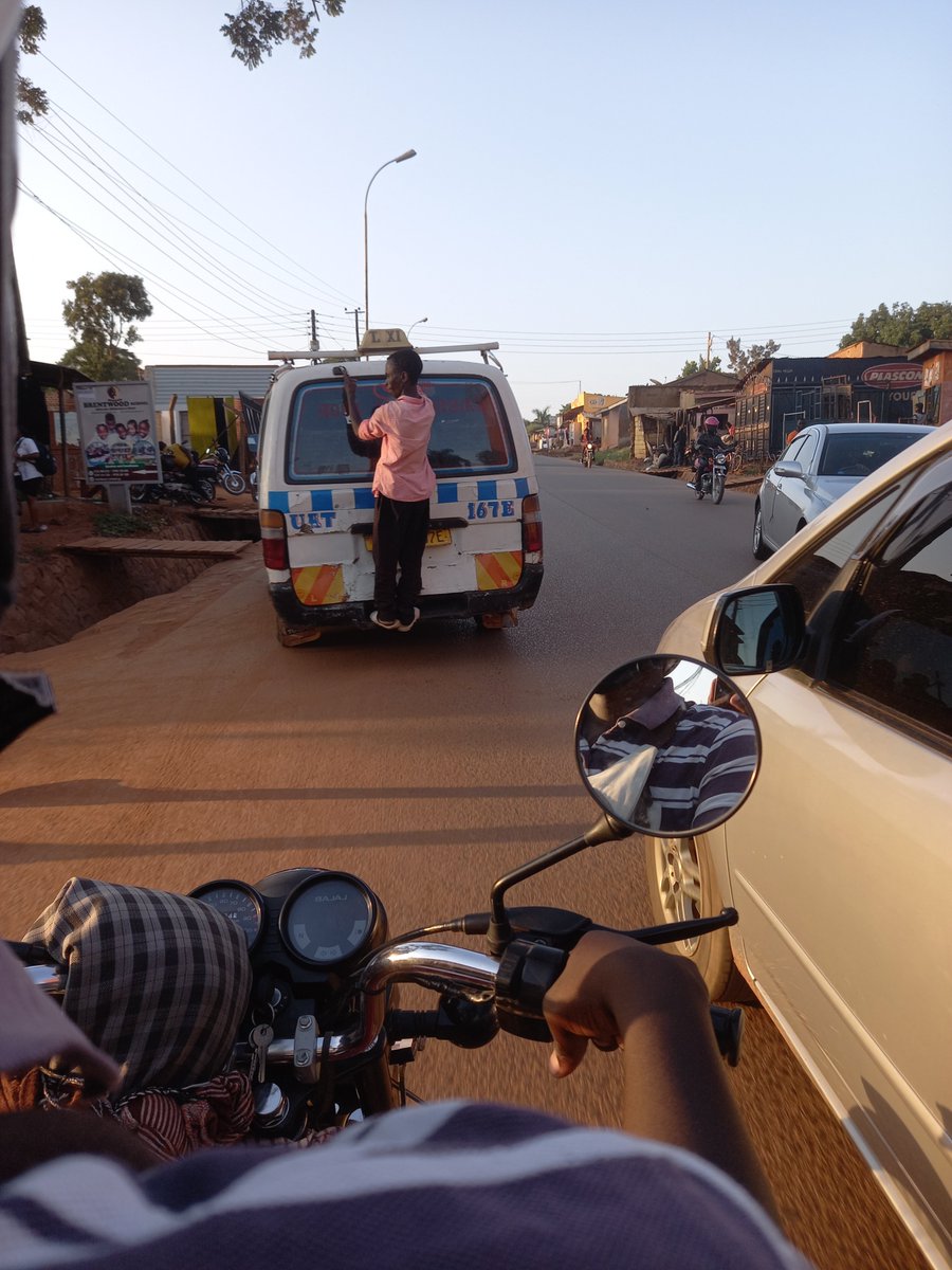 SafeDriveUg's tweet photo. #TaxiConductor seen along Ntinda-Kisaasi road standing on the car boot base since the taxi was full of passengers. #Stopcarelessdriving #stayinyourlane Let us #Speakup against careless driving @PoliceUg @AKasingye @qataharraymond @KCCAUG @thedprize https://t.co/qElE2qg4nr