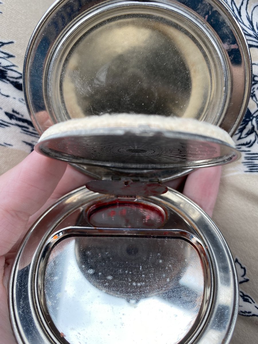 Unsure of brand, but this has been my daily compact. Anyone know how to get rid of the small spots on the mirror? I’ve used alcohol and glass cleaner and nothing. The wood is real and very pretty though
