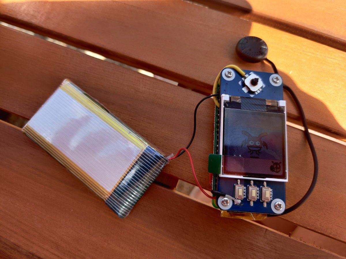 LapinsRose's tweet photo. Doing a battery test on Geminitchi. Outside getting some sun so he he's catching some rays as well. #tamagotchi #devilgotchi https://t.co/99Zyblzezk