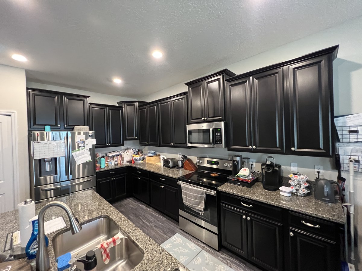 CabinetPaint's tweet photo. Around here, we call it #WowWednesday and here's why. This #ruskinfl client ditched the dated espresso look for #sherwinwilliams #lazygray and the results are phenomenal! Our entire team worked to make this #darktolight transformation happen #cabinetpaintingco #beforeandafter https://t.co/kEpdt8DLcN