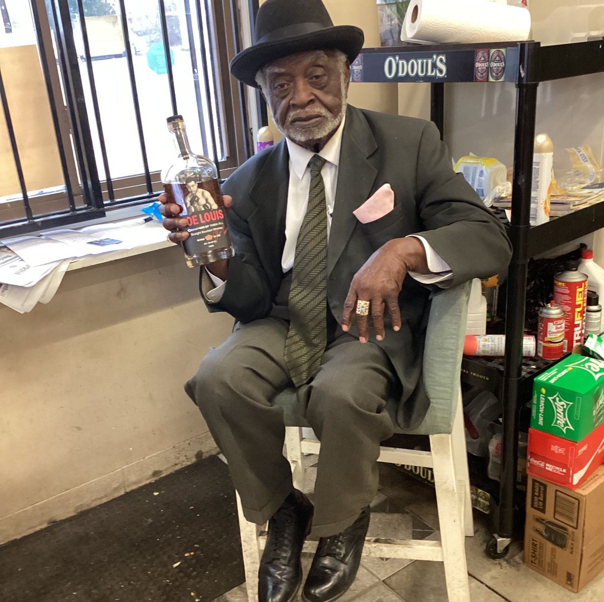 JoeLouisBourbon's tweet photo. The first liquor store in Radcliff, Kentucky is now carrying Joe Louis Bourbon! The owner of Fast Freddy's is excited to carry our promising spirit. Check out Freddy's outfit though! He dresses like a champion every single day! #bourbon #joelouis #kentucky https://t.co/cbpMJfQIZg