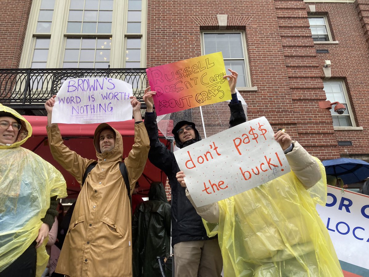 r_nusbaum's tweet photo. Brown grad workers out in the rain, getting loud to #ProtectOurRaise https://t.co/jjkUZWqLhB