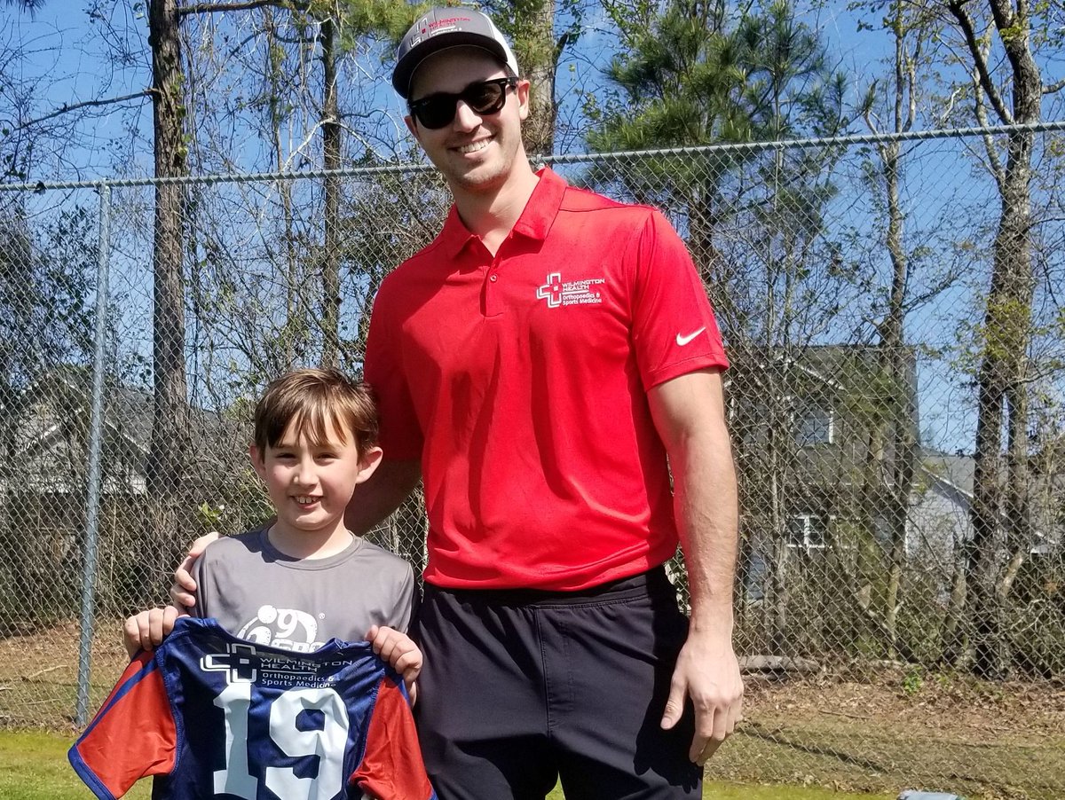 WilmHealth's tweet photo. Last week, Jonathan Heidkamp, PA-C, met with youth athletes on the Wilmington Health-sponsored team for i9 Sports to give them their new jerseys! #TRUEcare https://t.co/ZDi3GhJ8Za