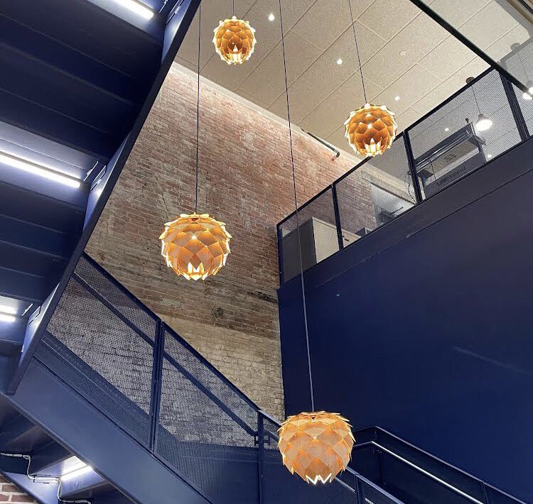 A feature of our new Boston Innovation Center we’re especially proud of - student made Pangolin light shades!  #fablab #steam #jobsofthefuture #making #liveyourpossible #TPZ