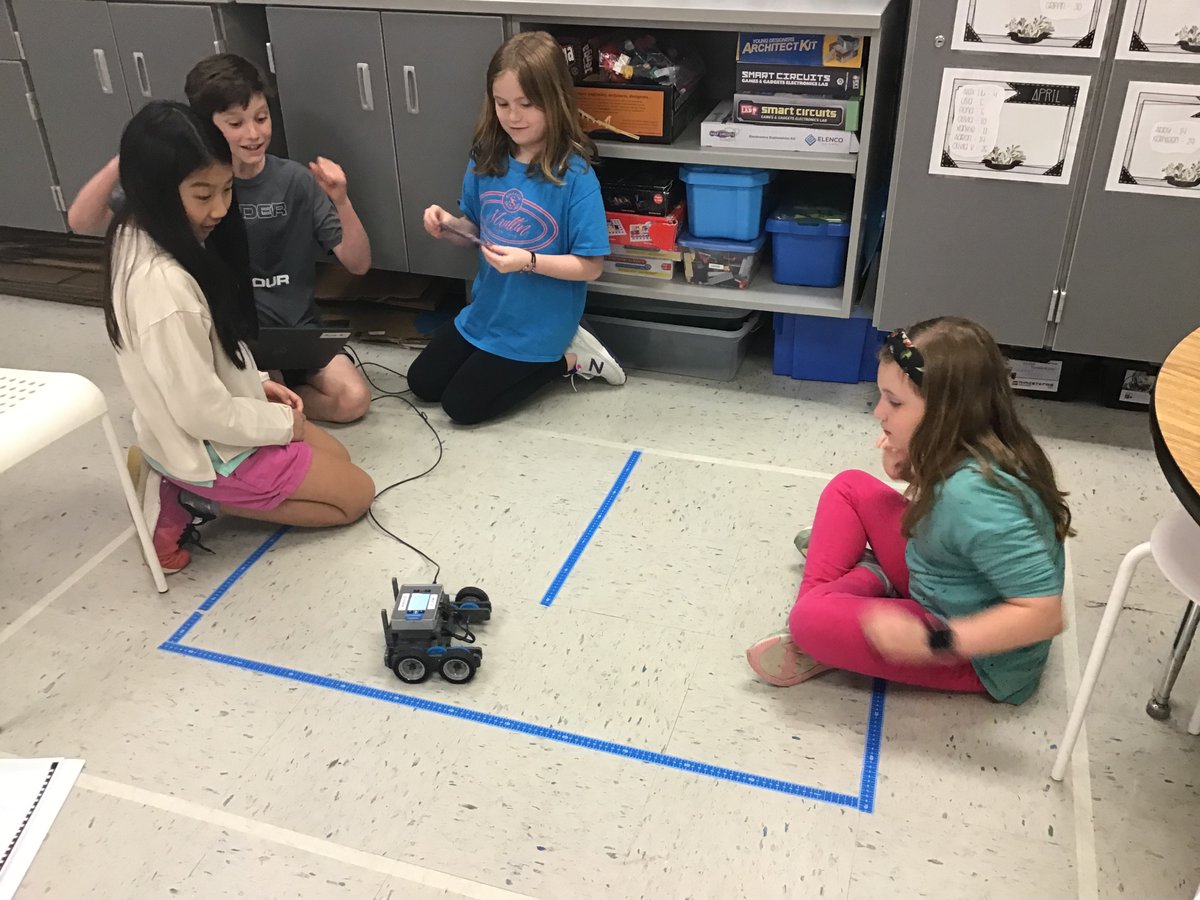 VHEWwhiddon's tweet photo. Love the looks of anticipation and excitement when you successfully program your robot through a maze that you have worked hard on.  #vhcs https://t.co/a286cL1BMt