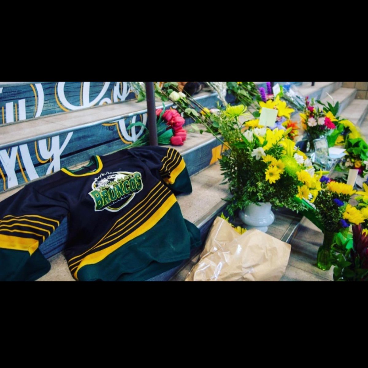 A Lump in my throat and tears in my eyes looking at these pics. We will never forget. Hockey sticks out- for Dayna and the boys. #HumboldtStrong
