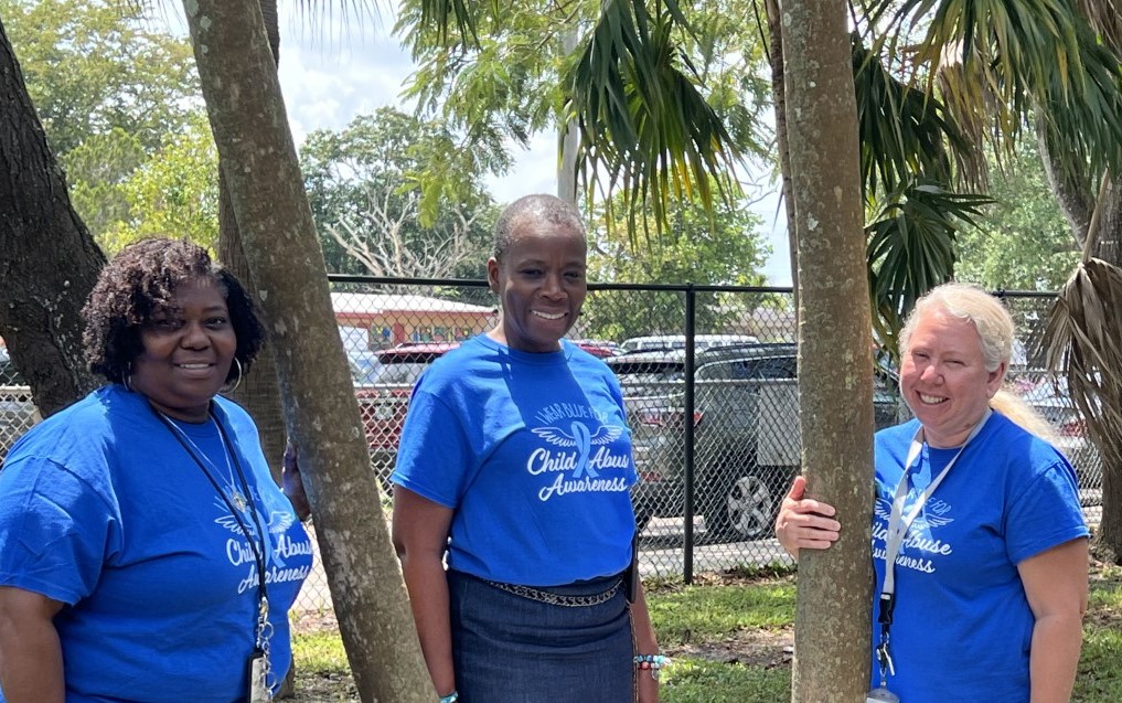 Broward Schools Child Abuse and Neglect Prevention Services wearing blue in support of: #GREATCHILDHOODS #BLUE4BROWARDAWARE