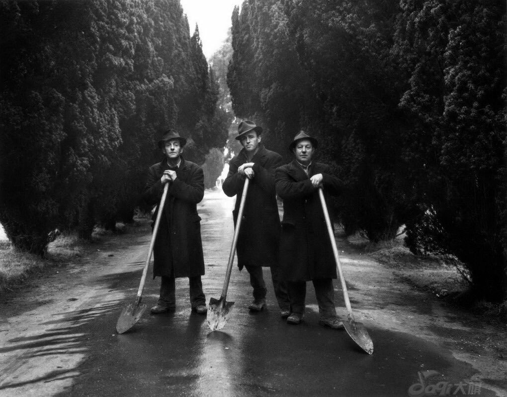 Gravediggers, Dublin, 1966 by Evelyn Hofer. I cannot imagine a more perfect composition for this photograph.
