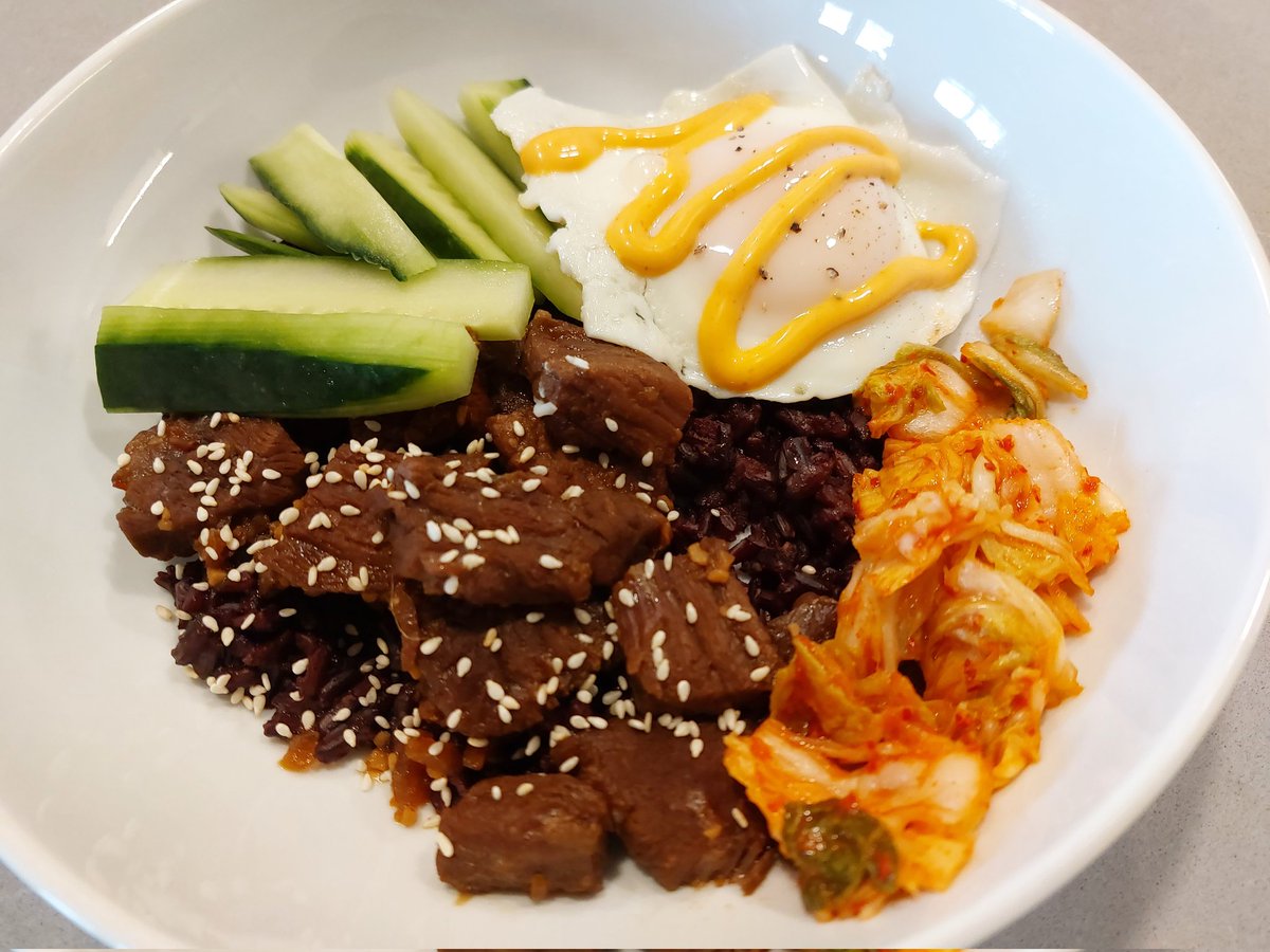 Beef Bulgogi bowls with black rice, cucumber, kimchi, and an over easy egg. Very tasty. #RetiredPrincipalInTheKitchen