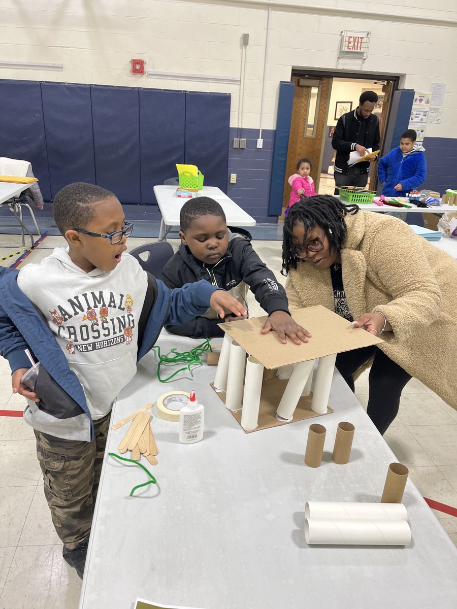 Building a house made of cardboard to protect the Three Little Pigs.  #BeEvergreen