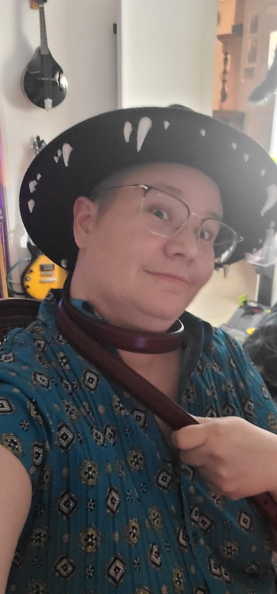 HeartJackrabbit's tweet photo. I usually prefer not to be Perceived, but #InternationalAceDay is wrapping up, so here I am: ace, queer, and whole. Over 30 and blissfully married since 2015 to an amazing woman. (Also wearing a hat with teeth, so there's that.) https://t.co/yI7IpObi2T