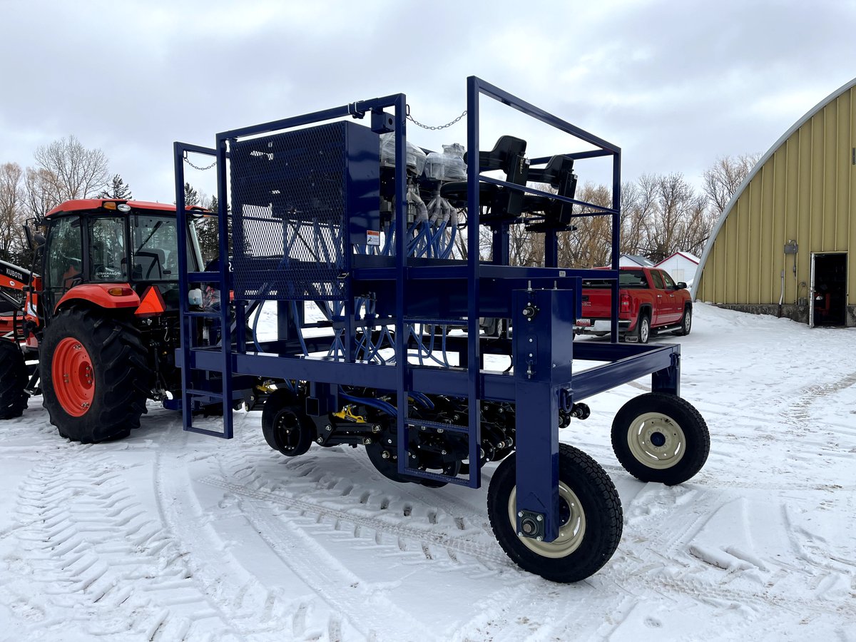 This is the JT-9PLW, it has nine Paralink walking disc openers on 8" or 16" row spacing and has two seed cones with our new version of the automated trip system