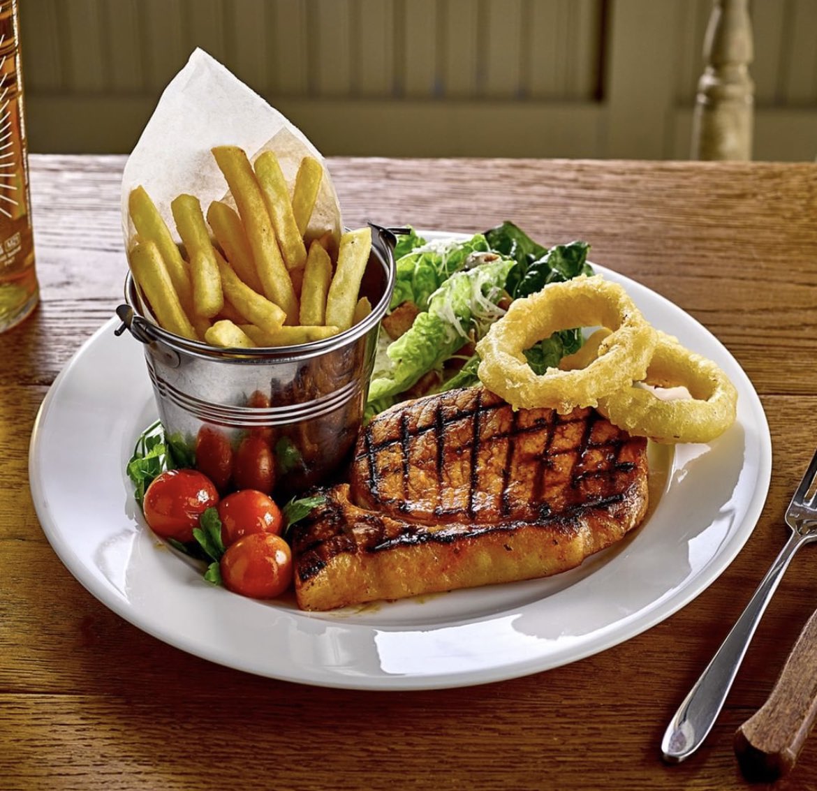 *•*•* DISH OF THE WEEK *•*•*  Why not pop along and try one of our tasty new dishes? This week we highly recommend our maple glazed bacon chop that’s served with fries, onion rings, vine tomatoes and a Caesar salad. 😋 #yummy #food #tasty