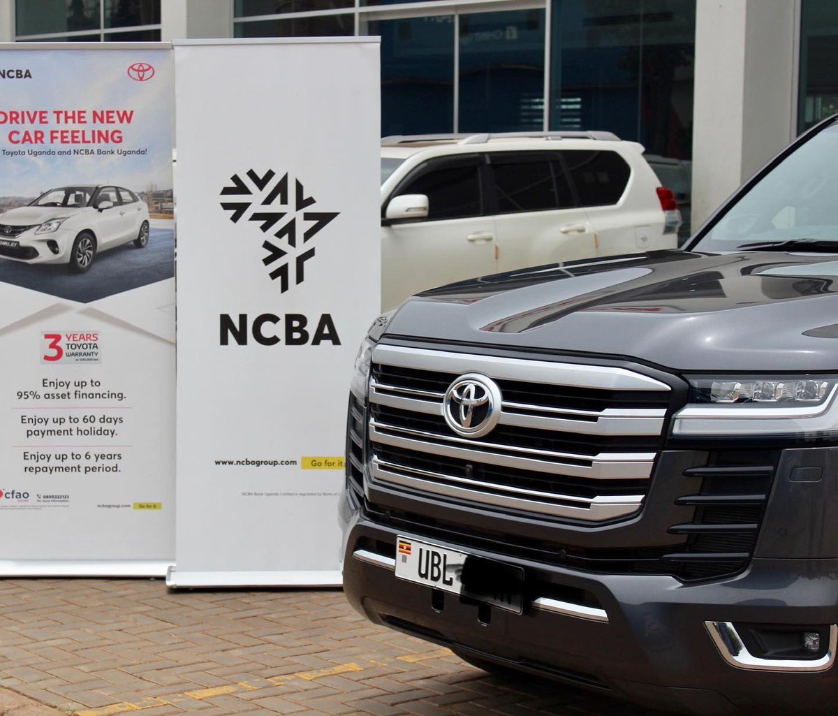 NCBAUganda's tweet photo. It’s your peace of mind that matters to us. We have handed over a brand new LAND CRUISER 300 through our partnership with CFAO motors.
visit: https://t.co/lZzqIwfJEy to apply for Asset financing today. 

Call our toll free number 0800222123 for more information 
#goforit https://t.co/CP141X42Yo