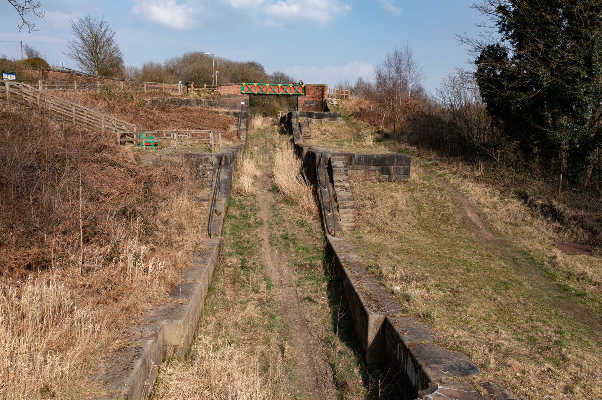 martin_0401's tweet photo. The empty locks at Nob end with the Meccano bridge in the distance. A monument to another time. But still a joy to look upon today. The toil purpose and craftsmanship. The antithesis to a selfie generation. I sound old. But on point 😀 #canal #TheNextGeneration https://t.co/80qFwmrJzP